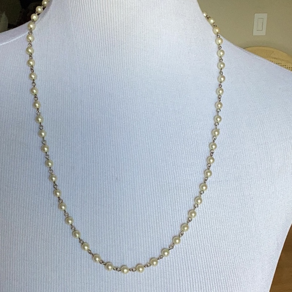 Neverending pearl and chain necklace with 10” drop.  No fasteners